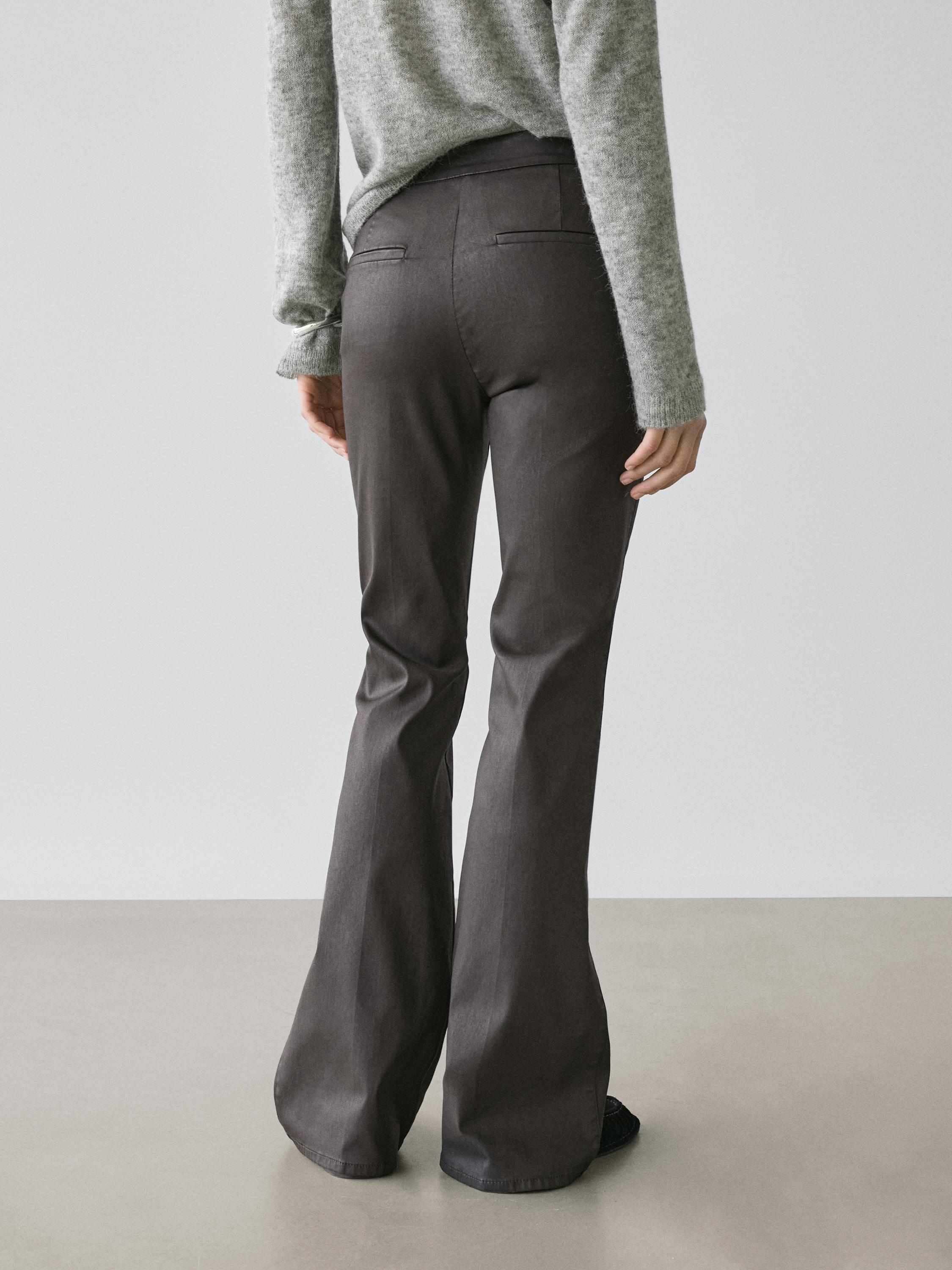 Waxed flare fit trousers